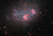 Hubble Celebrates Christmas with a Stunning Image of a Galaxy Resembling a Sparkling Snow Globe